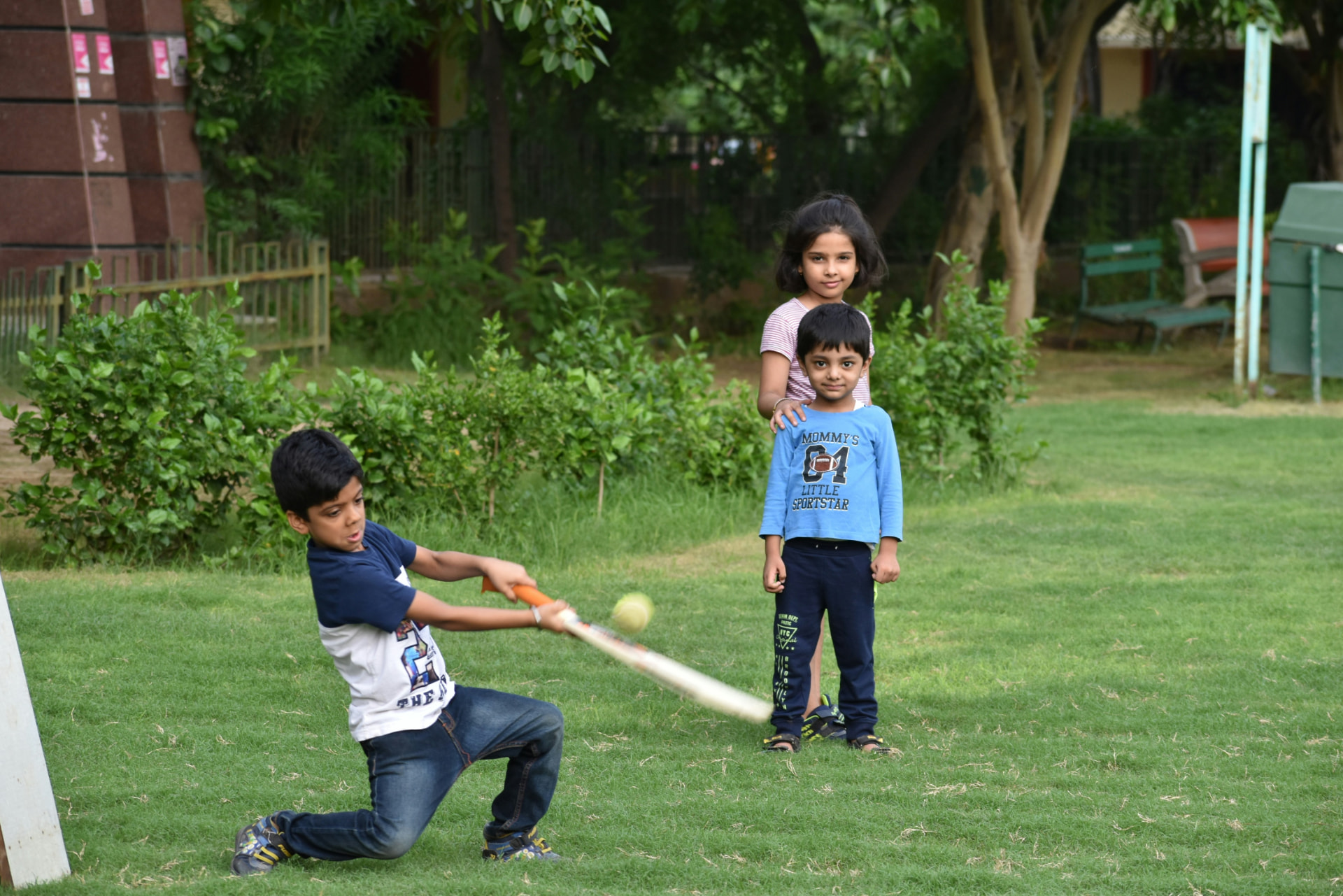 Kids playing a pickup game in a neighborhood park